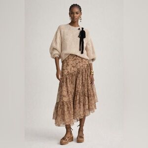 Ulla Johnson cream colored sweater with black ribbon tie detail at neck. Size S